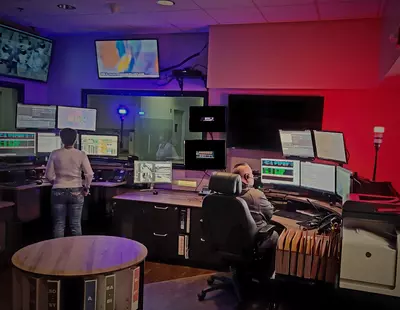 Two 9-1-1 Dispatchers working in the Telecommunications Center