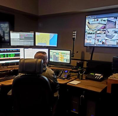 9-1-1 Dispatcher Sitting at a Console